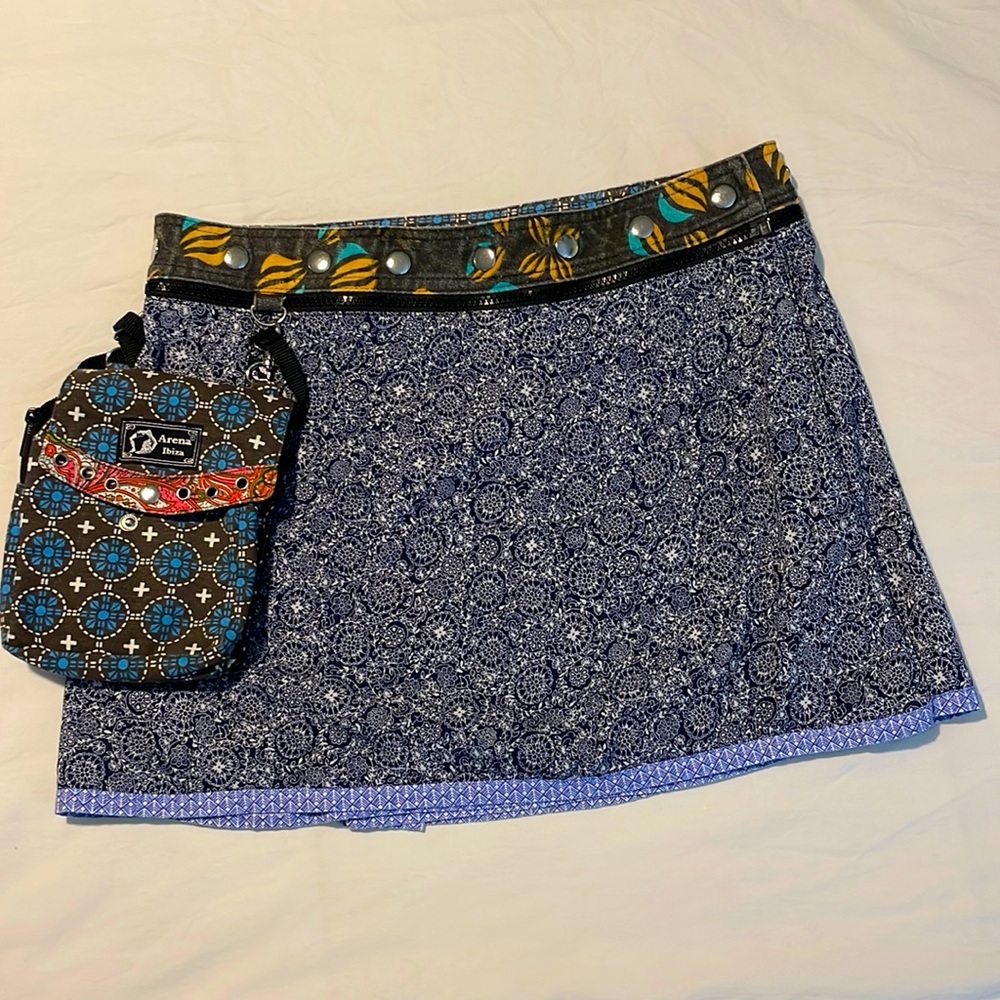 Arena reversible miniskirt with adjustable snap waistline. One size fits most.